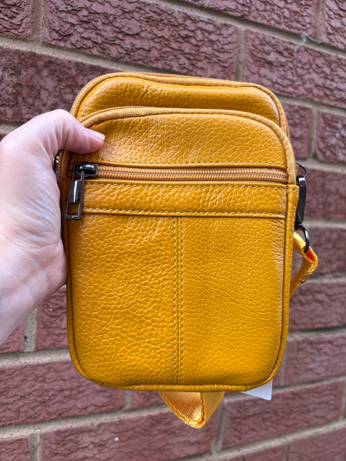 Leather style cross body bag with zipped pockets mustard colour