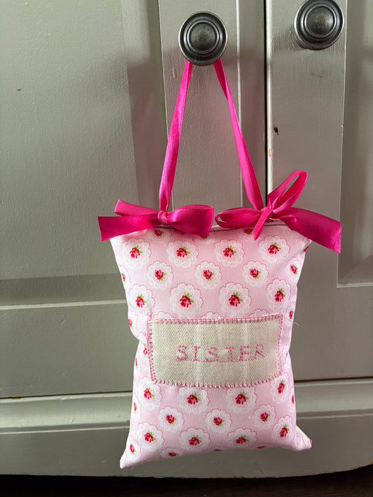 Sister handmade embroidered hanger by Rosie