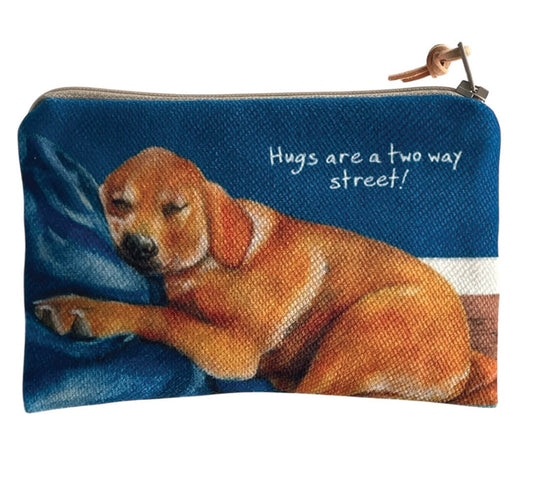 Labrador hugs purse