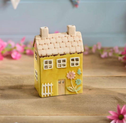 Yellow sunshine village pottery house