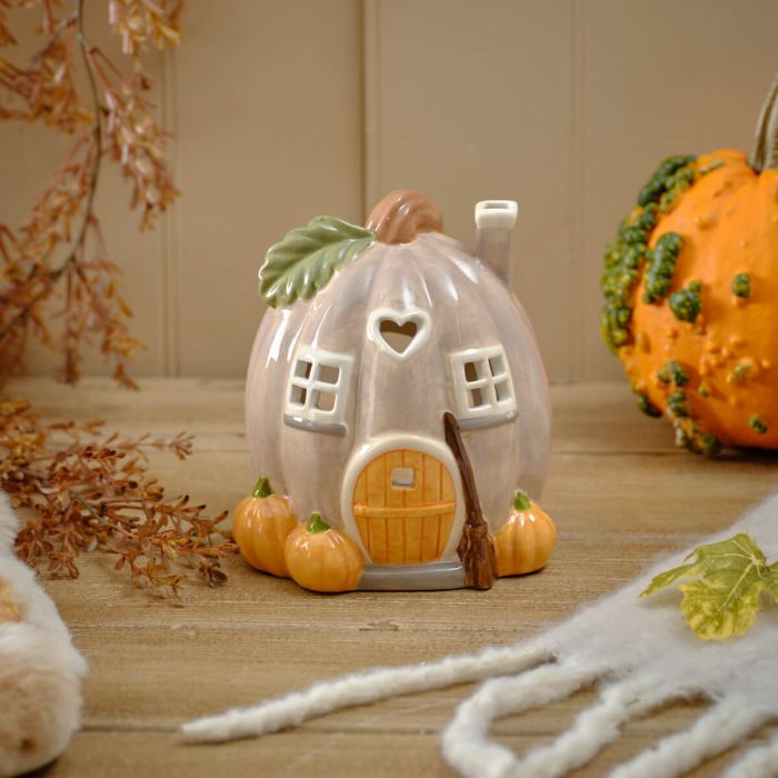 Harvest home shaped pumpkin candle house