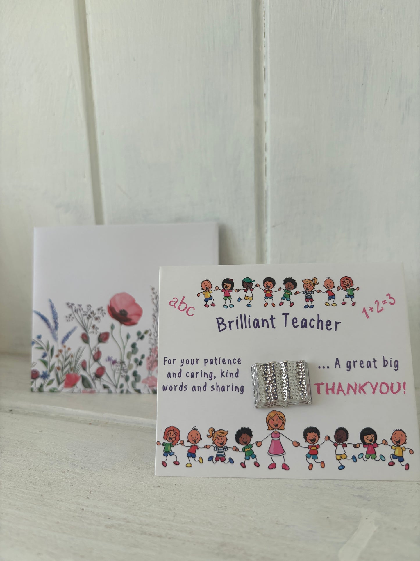 Teacher card and brooch