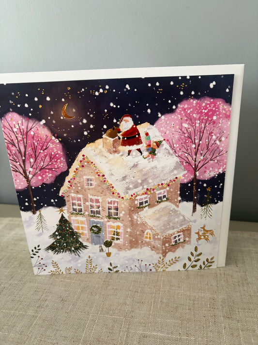 Santa delivering christmas card