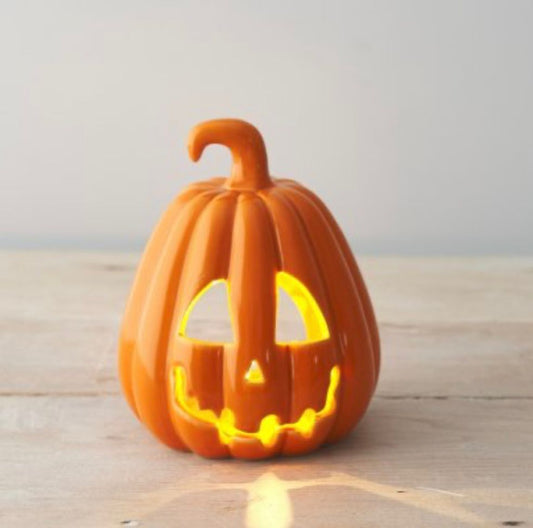 Orange carved pumpkin lantern